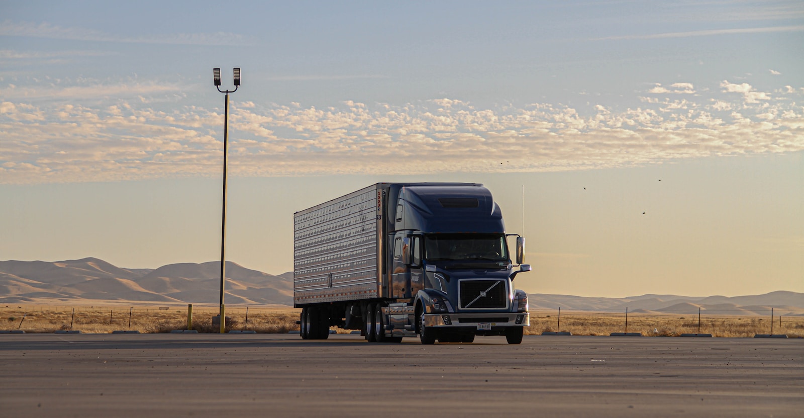 black truck on road during daytime, trailers