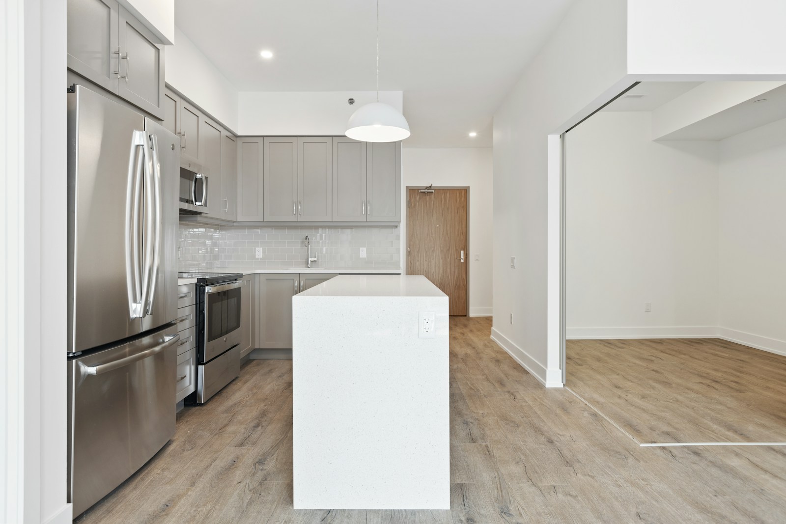 condo, white wooden kitchen cabinet near white wall